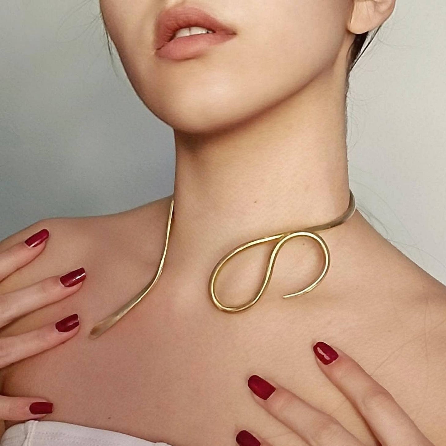 Hammered brass snake necklace