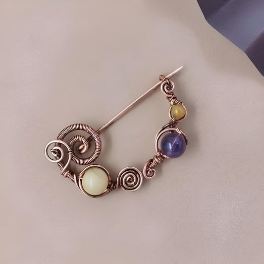 Copper wire brooch with amethyst and yellow jade beads, German silver and brass crescent brooch with filigree and stones